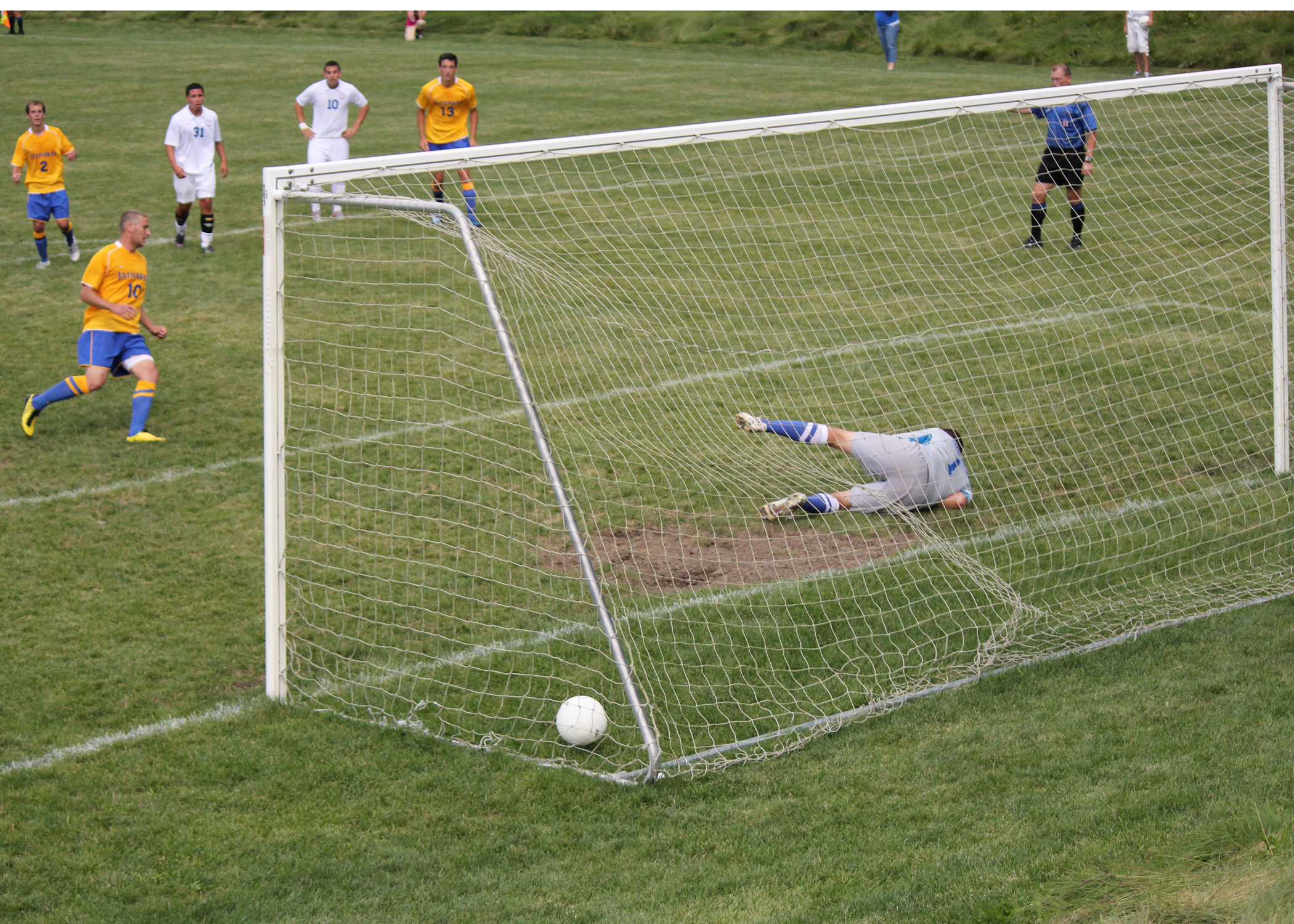 Nathan Schmitt scores one of his three goals on a penalty kick against Ancilla College.