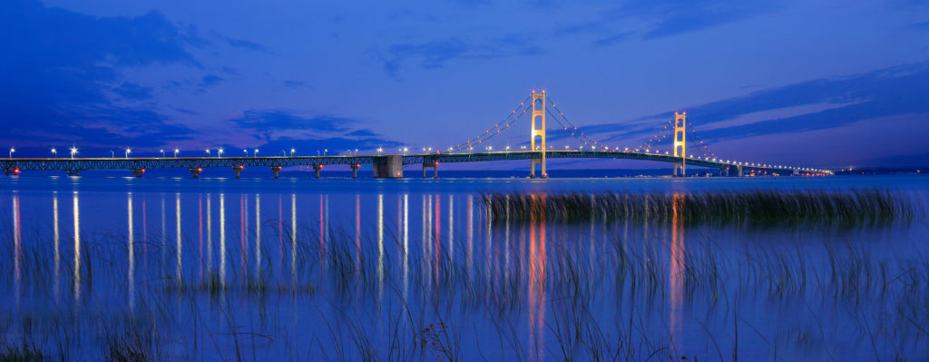 Seen From St Ignace in the upper peninsula at dusk, the Mackinac Bridge spans the upper and lower peninsulas of Michigan, USA