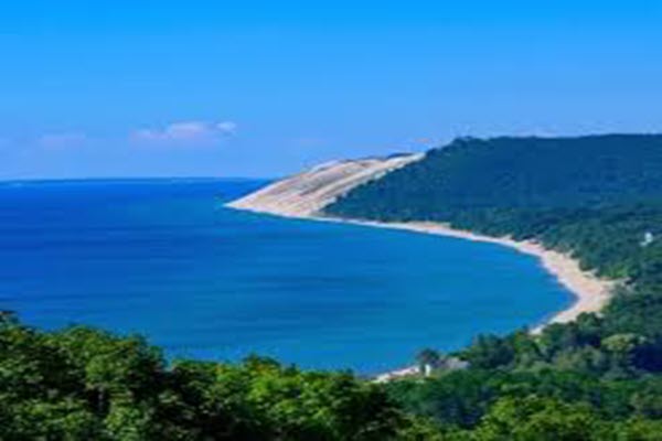 Three female nurses working with a patient