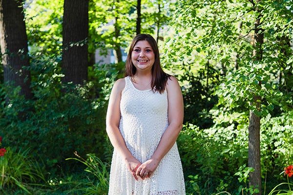 Val in a white dress