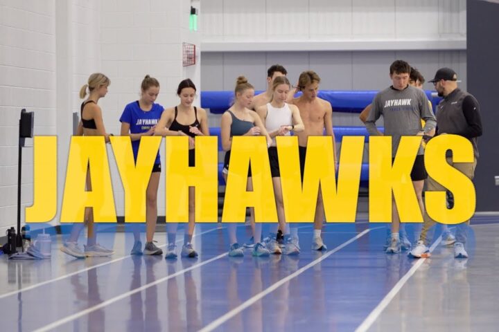 Track and Field athletes behind a Font that reads Jayhwaks.