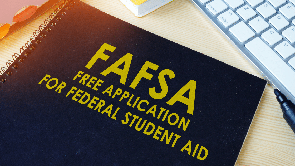 A spiral notebook that says 