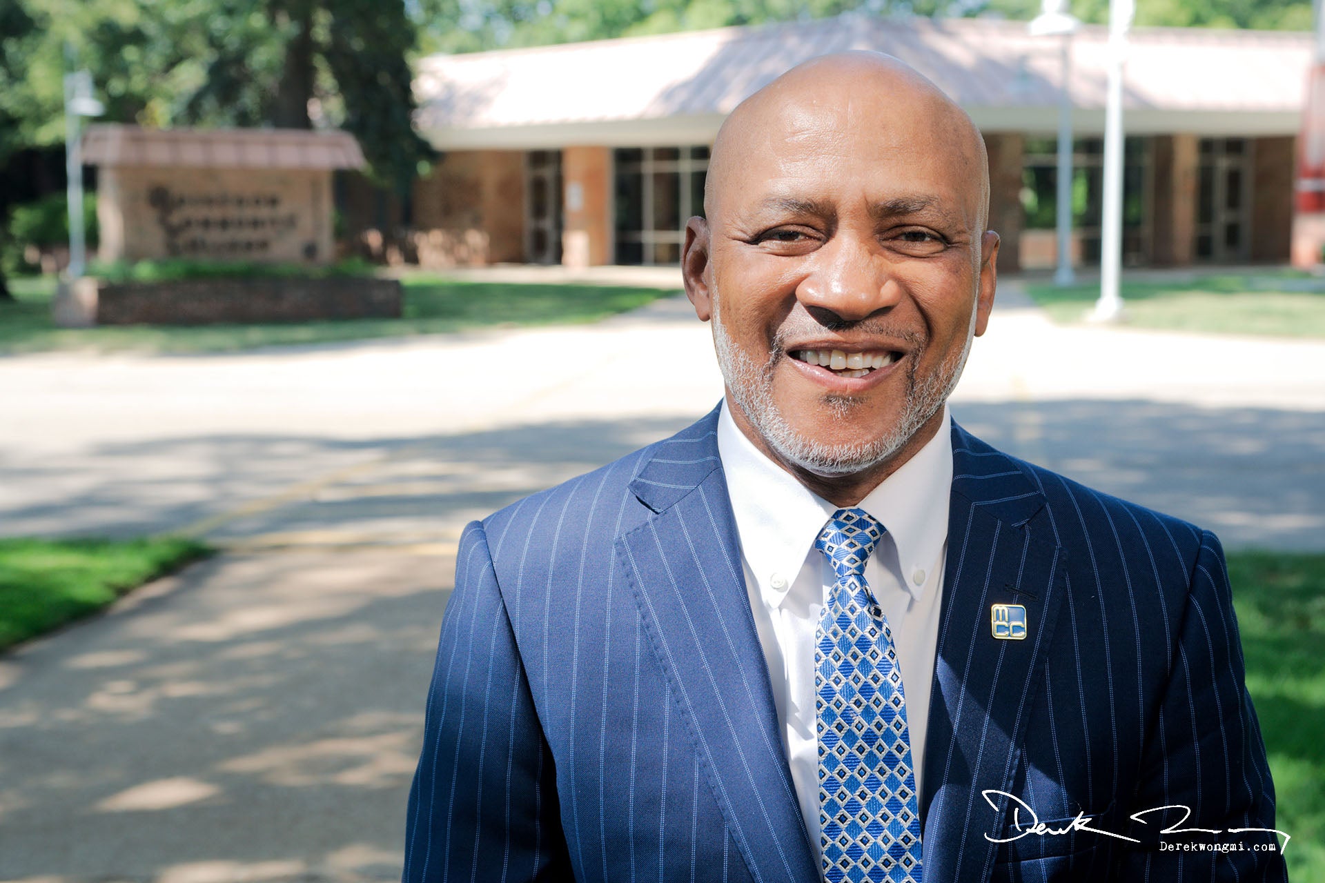 MCC President John Selmon standing in the sunshine in front of the MCC Main Building